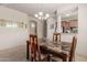 Dining room with a granite table, chandelier, and kitchen view at 14815 N Fountain Hills Blvd # 201, Fountain Hills, AZ 85268