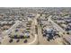Aerial view of a residential neighborhood with houses and a park at 14971 W Desert Hills Dr, Surprise, AZ 85379