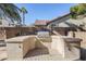 Outdoor kitchen with built-in grill at 14971 W Desert Hills Dr, Surprise, AZ 85379