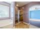 Bathroom with soaking tub, shower, and tile flooring at 14971 W Desert Hills Dr, Surprise, AZ 85379