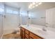 Bathroom with double sinks, tile flooring and bathtub at 14971 W Desert Hills Dr, Surprise, AZ 85379