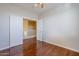 Spacious bedroom with hardwood floors and access to upper loft at 14971 W Desert Hills Dr, Surprise, AZ 85379