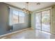 Bright dining room with sliding glass doors leading to backyard at 14971 W Desert Hills Dr, Surprise, AZ 85379