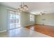 Open dining area with hardwood floors and view of the pool at 14971 W Desert Hills Dr, Surprise, AZ 85379