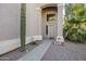 Front entry with walkway, mature cactus, and neutral color scheme at 14971 W Desert Hills Dr, Surprise, AZ 85379
