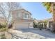 Two-story house with a two-car garage and desert landscaping at 14971 W Desert Hills Dr, Surprise, AZ 85379