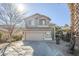 Two-story house with a two-car garage and desert landscaping at 14971 W Desert Hills Dr, Surprise, AZ 85379