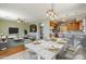Modern kitchen with breakfast bar and dining area at 14971 W Desert Hills Dr, Surprise, AZ 85379