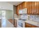 View of kitchen stove and microwave at 14971 W Desert Hills Dr, Surprise, AZ 85379