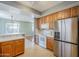 Kitchen features stainless steel appliances and an island at 14971 W Desert Hills Dr, Surprise, AZ 85379