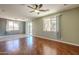 Living room with hardwood floors and ceiling fan at 14971 W Desert Hills Dr, Surprise, AZ 85379
