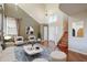 Bright living room with high ceilings and hardwood floors at 14971 W Desert Hills Dr, Surprise, AZ 85379