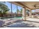 Covered patio overlooking the pool and BBQ area at 14971 W Desert Hills Dr, Surprise, AZ 85379