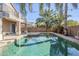 Inviting pool with palm trees and string lights at 14971 W Desert Hills Dr, Surprise, AZ 85379
