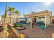 Large backyard with covered patio, seating, and play area at 1758 E Sandra Ter, Phoenix, AZ 85022