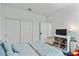 Spacious bedroom with large closet and TV at 17838 W Gambit Trl, Surprise, AZ 85387