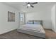 Bright bedroom with a comfortable king-size bed at 17838 W Gambit Trl, Surprise, AZ 85387