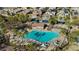 Community pool with palm trees, lounge chairs, and a pool house at 17838 W Gambit Trl, Surprise, AZ 85387