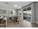 Bright dining room with sliding glass doors leading to backyard at 17838 W Gambit Trl, Surprise, AZ 85387