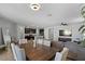 Modern dining room with a large wooden table and six chairs at 17838 W Gambit Trl, Surprise, AZ 85387