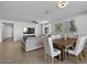 Open concept dining room adjacent to living room and kitchen at 17838 W Gambit Trl, Surprise, AZ 85387