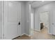 Bright entryway with view of bathroom and hallway at 17838 W Gambit Trl, Surprise, AZ 85387