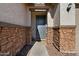 Inviting entryway with stone accents and a gray front door at 17838 W Gambit Trl, Surprise, AZ 85387