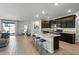 Modern kitchen with island and stainless steel appliances at 17838 W Gambit Trl, Surprise, AZ 85387