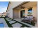 Covered patio with seating area and pool view at 17838 W Gambit Trl, Surprise, AZ 85387
