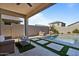 Relaxing backyard oasis with a sparkling pool at 17838 W Gambit Trl, Surprise, AZ 85387
