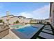 Inviting backyard pool with spacious patio and water feature at 17838 W Gambit Trl, Surprise, AZ 85387