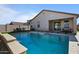 Clean lines and refreshing blue water in this backyard pool at 17838 W Gambit Trl, Surprise, AZ 85387
