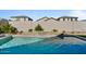 Relaxing pool area featuring a stone water feature at 17838 W Gambit Trl, Surprise, AZ 85387