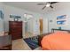 Bedroom with orange bedding and double closets at 1840 S Vista Rd, Apache Junction, AZ 85119