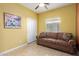 Bonus room with brown couch and tiled floors at 1840 S Vista Rd, Apache Junction, AZ 85119