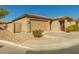 Tan colored house with a two-car garage and a gate at 1840 S Vista Rd, Apache Junction, AZ 85119
