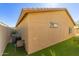 Tan house exterior with artificial turf and chairs at 1840 S Vista Rd, Apache Junction, AZ 85119