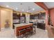 Spacious kitchen with granite countertops and dark wood cabinets at 1840 S Vista Rd, Apache Junction, AZ 85119