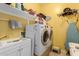 Bright laundry room, washer, dryer, and utility sink at 1840 S Vista Rd, Apache Junction, AZ 85119