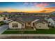 Stunning ranch home with brick and white siding, showcasing a modern farmhouse design at 19727 E Vallejo St, Queen Creek, AZ 85142