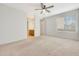 Bright bedroom with carpet flooring and a ceiling fan at 2100 W Lemon Tree Pl # 84, Chandler, AZ 85224