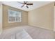 Bright bedroom with window, ceiling fan and carpet at 2100 W Lemon Tree Pl # 84, Chandler, AZ 85224