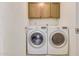 Laundry room with LG washer and dryer, and wood cabinets at 2100 W Lemon Tree Pl # 84, Chandler, AZ 85224