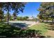 Outdoor basketball court with shaded seating areas and surrounding green space at 2123 E Saratoga St, Gilbert, AZ 85296