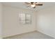 Bright bedroom with ceiling fan and neutral carpet at 2123 E Saratoga St, Gilbert, AZ 85296