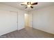 Bedroom with ceiling fan and closet at 2123 E Saratoga St, Gilbert, AZ 85296