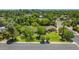 Aerial view of a home with mature trees, grassy lawn, and beautiful landscaping in a desirable neighborhood at 245 W Berridge Ln, Phoenix, AZ 85013