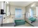 Retro bathroom with mint green bathtub and a vintage vanity at 245 W Berridge Ln, Phoenix, AZ 85013