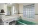 Retro bathroom with mint green bathtub and a vintage vanity at 245 W Berridge Ln, Phoenix, AZ 85013