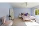 Bedroom with a bed, chair, and window at 245 W Berridge Ln, Phoenix, AZ 85013